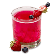 Refreshing protein drink in a glass, garnished with strawberries and blueberries, showcasing vibrant red color.